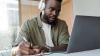 A man studying an English Online course on his laptop